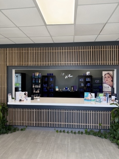 Reception area with wood slat wall at 360 Wellness